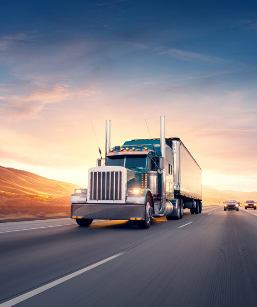 American,Style,Truck,On,Freeway,Pulling,Load.,Transportation,Theme.,Road